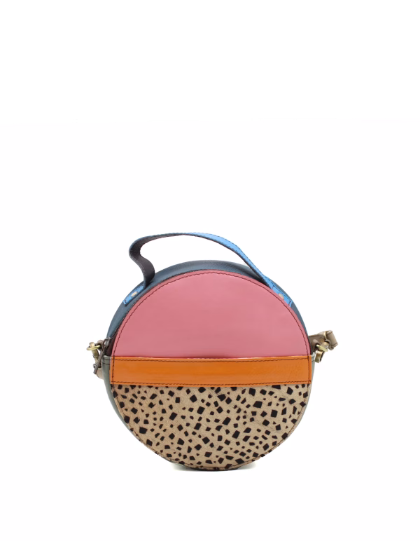 Pink animal print recycled leather circular crossbody bag by Soruka